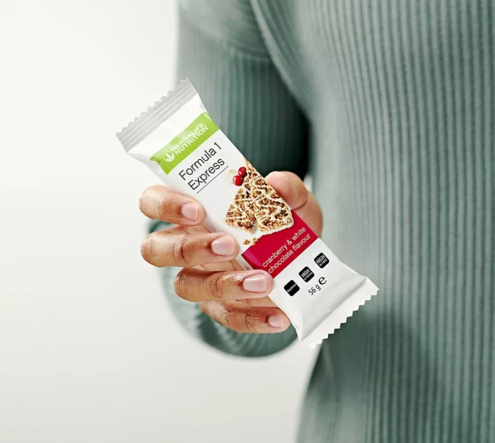 li-man-holding-cranberry-express-bar.webp